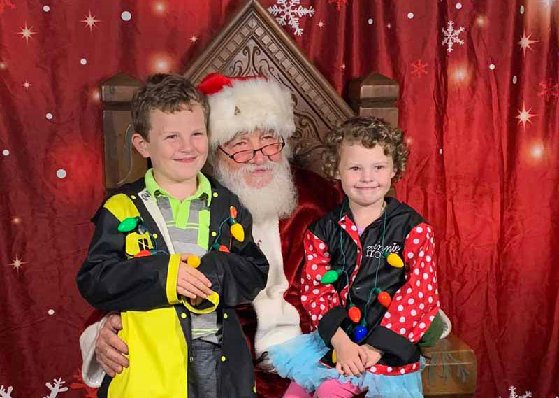 Santa and kids at light up valley village