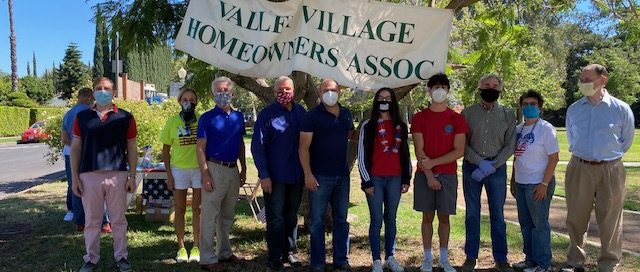 NCVV Board members Dorothy Apple, Alice Hart and Tony Braswell join elected officials in honoring Eileen Garcia and Jake Kovinsky