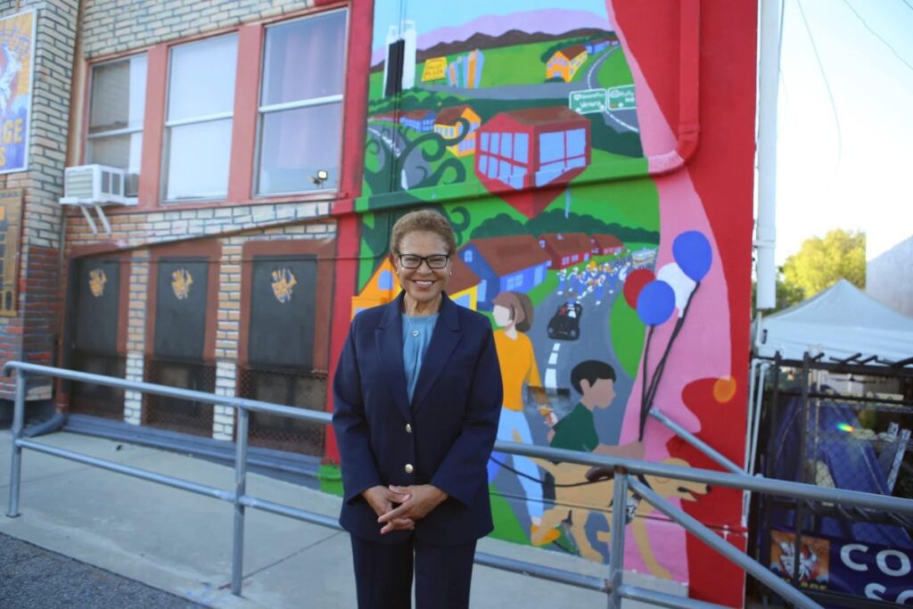 Mayor Bass in front of mural