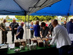 People talking at coffee with a cop, Coffee on table in foreground